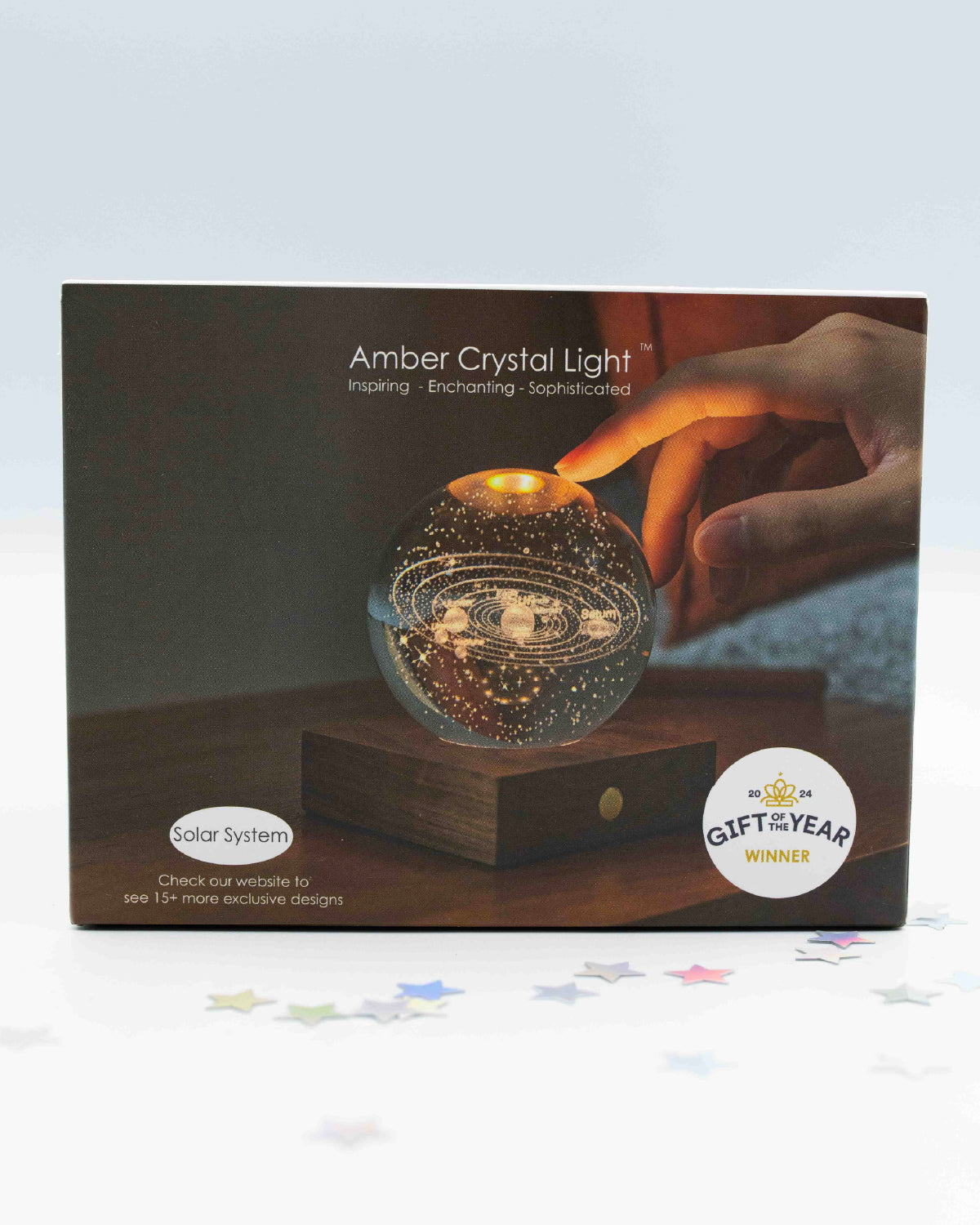 Gingko Amber Crystal Light box showing the solar system crystal ball on walnut