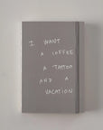 Gray Poète notebook with the cover quote I want a coffee, a tattoo and a vacation