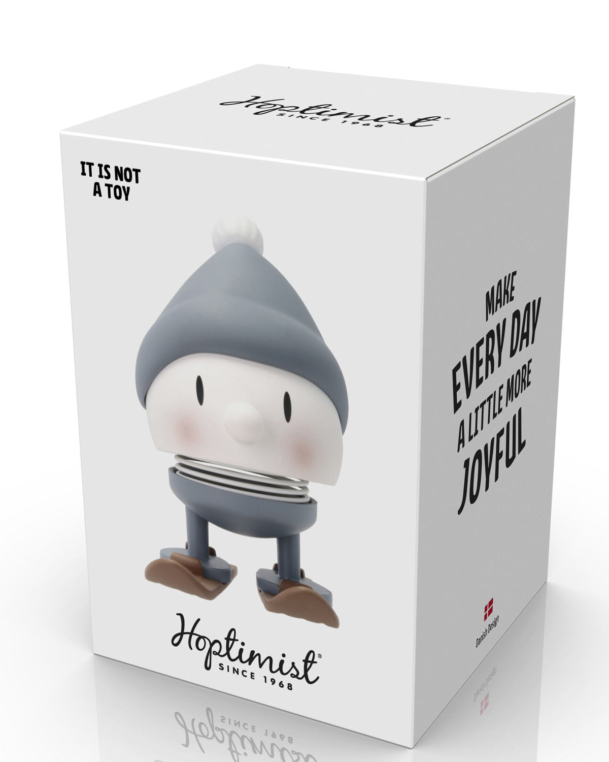 Hoptimist Skiing Bumble figure in front of its white box