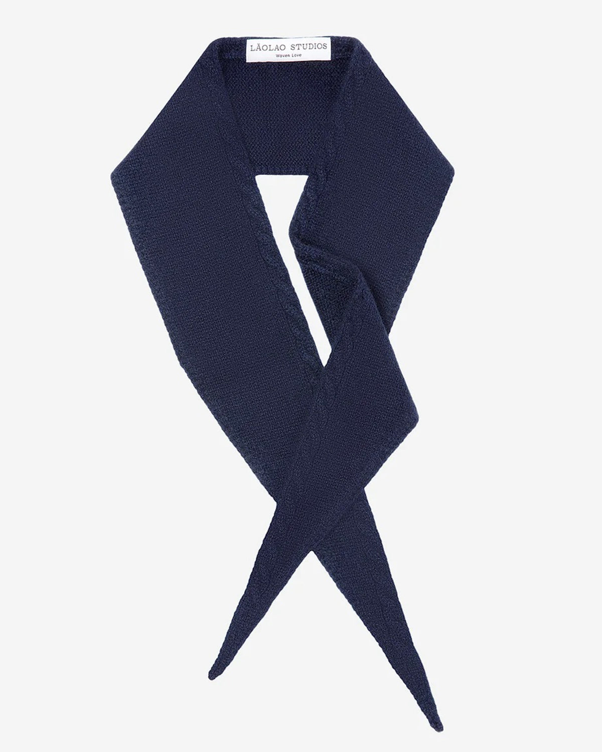 Laolao Studios cashmere mini scarf in navy, crossed in a loose loop on white