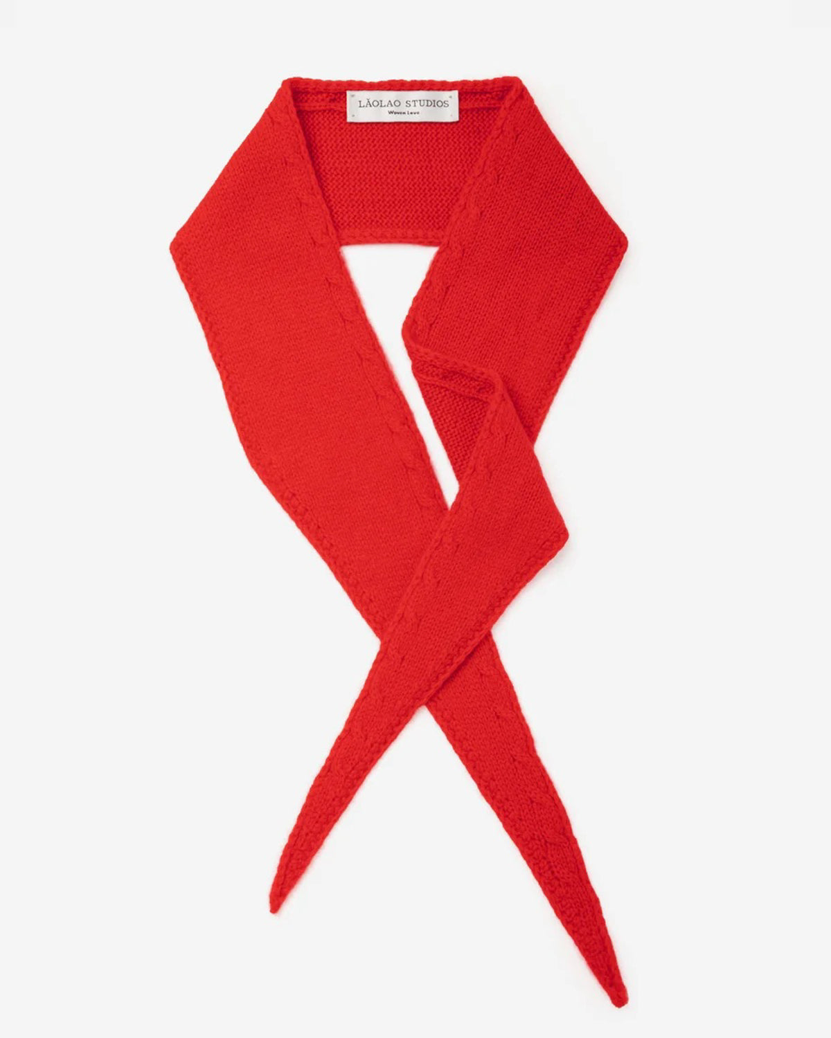 Laolao Studios cashmere mini scarf in red, crossed in a loose loop on white