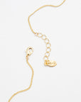 Gold necklace with a lobster closure on a white background