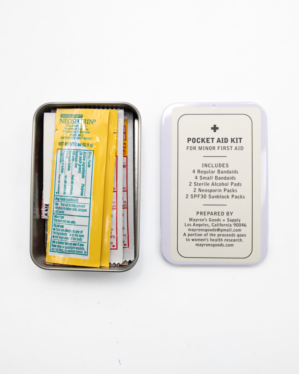 Mayron's Goods Pocket Aid Kit tin open beside its lid listing what's included