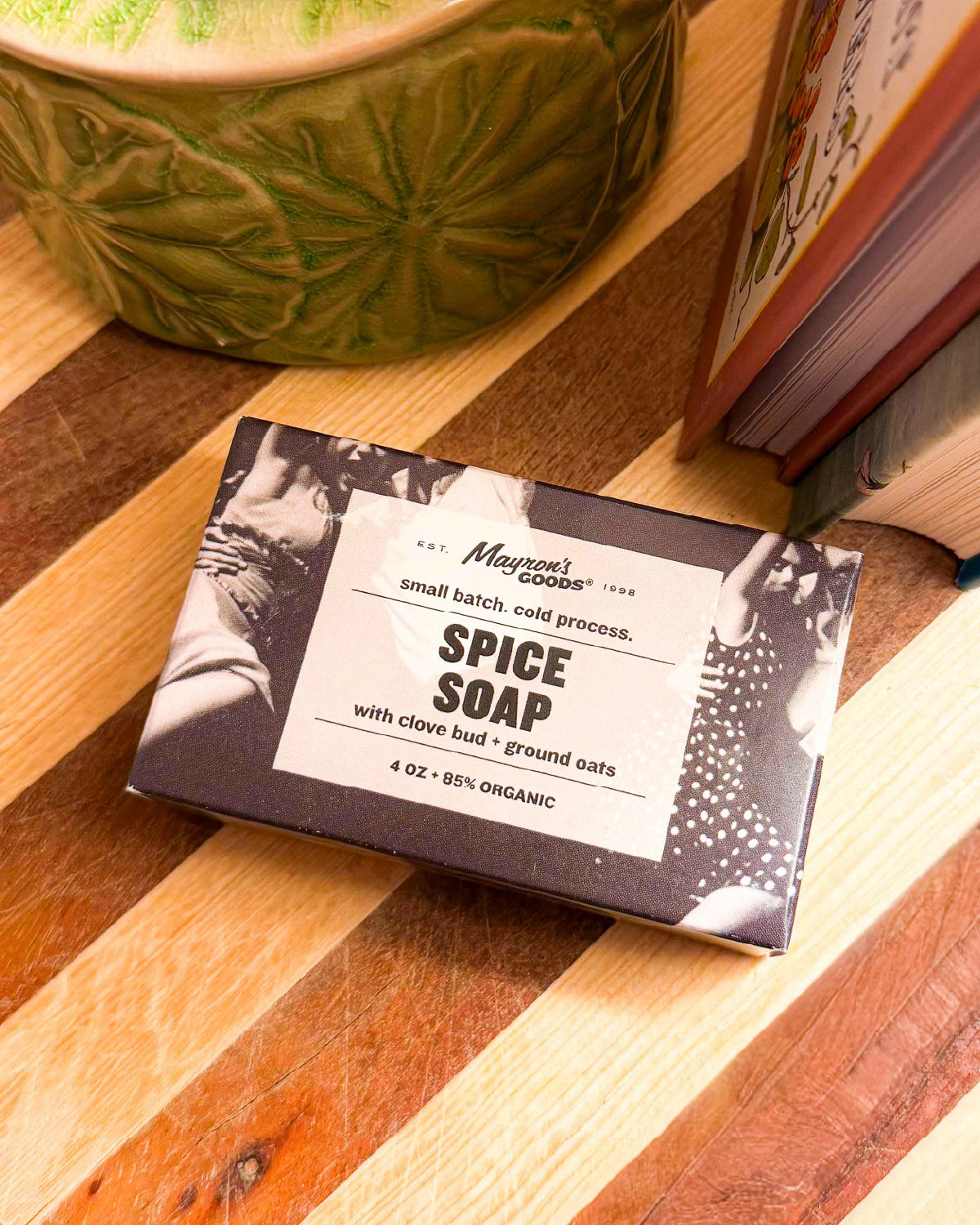Boxed Mayron's Goods Spice Soap on a striped wooden cutting board