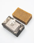 Mayron's Goods oat-flecked spice soap bar beside its black and white box