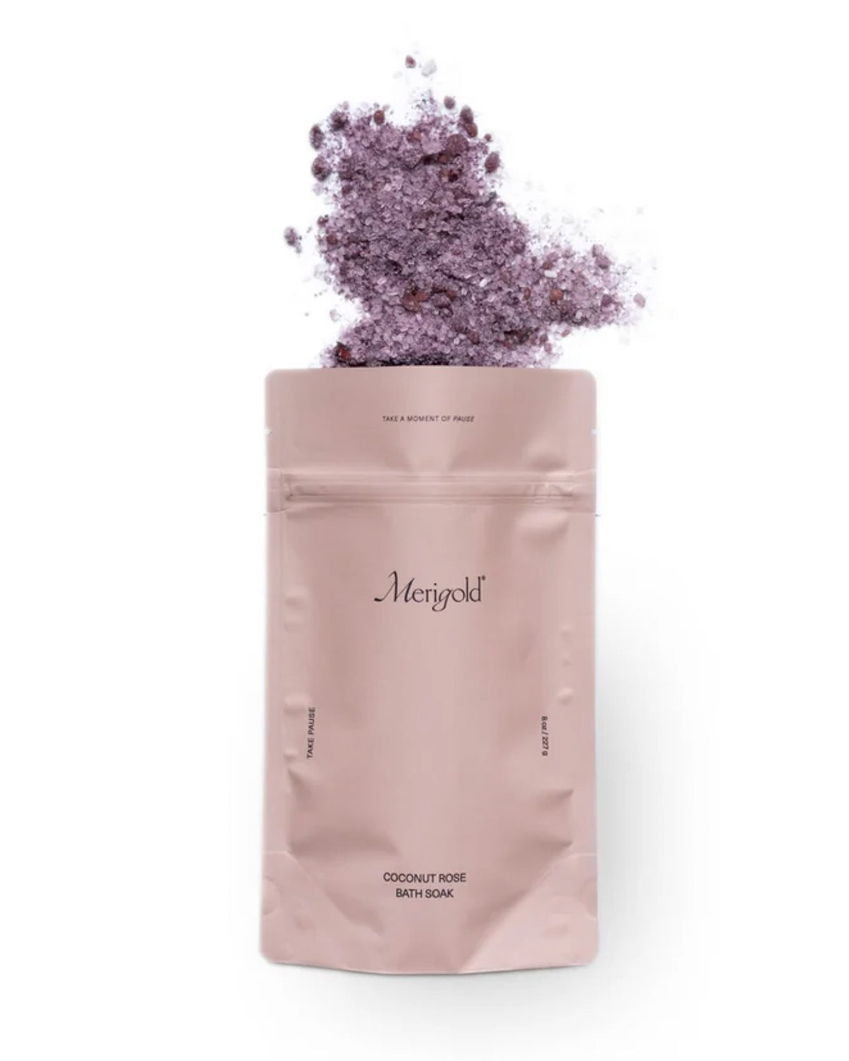 Coconut Rose bath salts with rose petals spilling from the top of the Merigold pouch