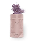 Coconut Rose bath salts with rose petals spilling from the top of the Merigold pouch