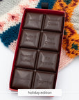 Miss Maude's Holiday Edition dark chocolate bar with squares like Spiced Cider and Eggnog