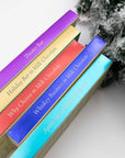 Five Miss Maude's milk chocolate bars fanned out: Theater, Holiday, Why Choose, Whiskey Business and Après-Ski
