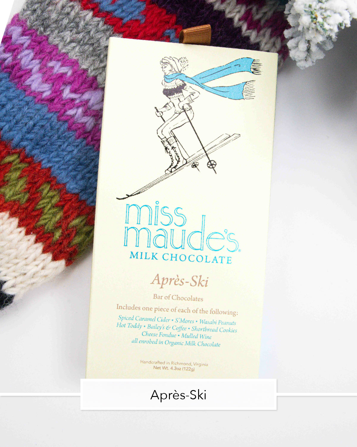 Miss Maude's Après-Ski milk chocolate bar with a skier illustration on a knit sweater