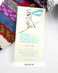 Miss Maude's Après-Ski milk chocolate bar with a skier illustration on a knit sweater