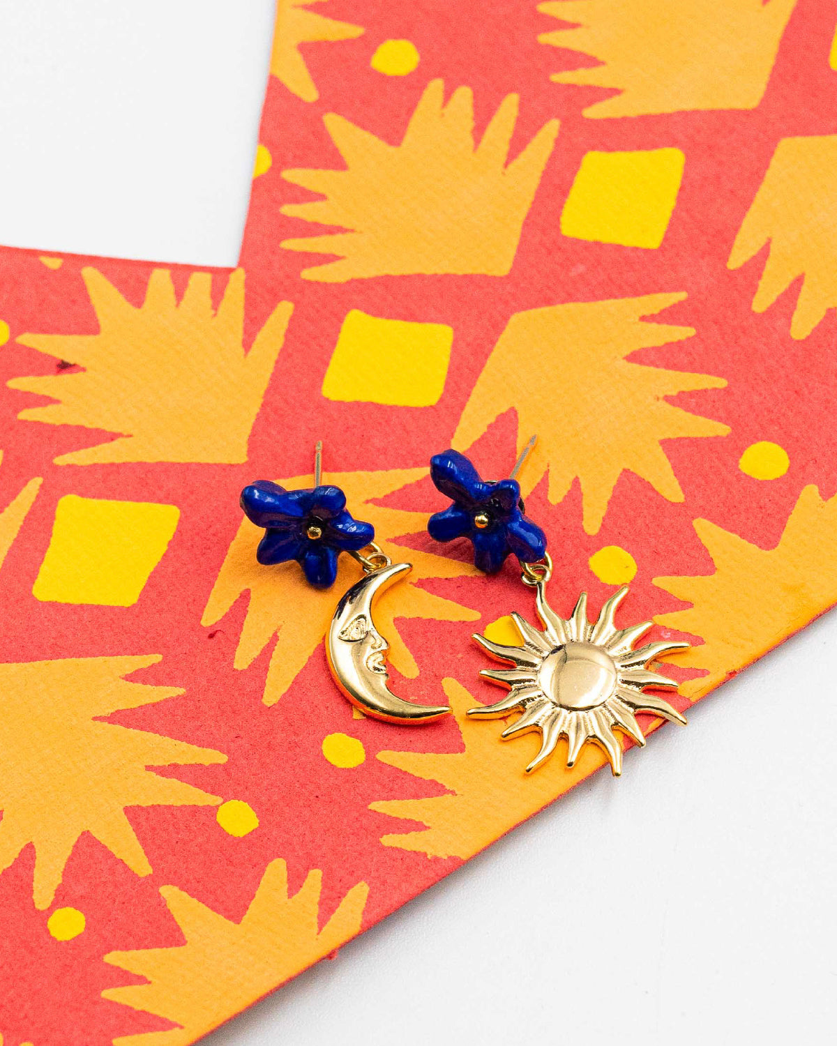 Nach Bijoux asymmetric earrings, a moon and a sun, with blue porcelain flower studs