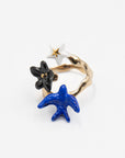 Nach Bijoux porcelain ring with a blue swallow, black flower and white star on a gold band