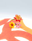 Nach Bijoux hand-painted porcelain floral and gold ring on an abstract background