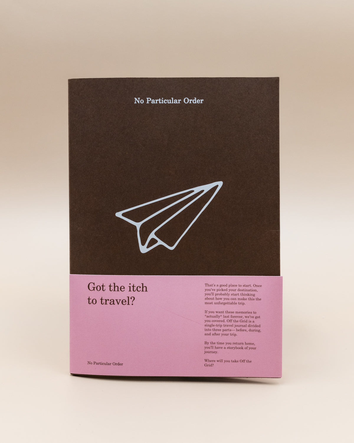 No Particular Order Off the Grid travel journal in brown with a pink band on the cover