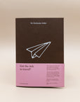 No Particular Order Off the Grid travel journal in brown with a pink band on the cover