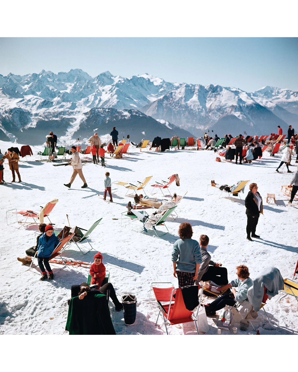 Completed Verbier Vacation puzzle image of skiers lounging on snow below Alpine peaks