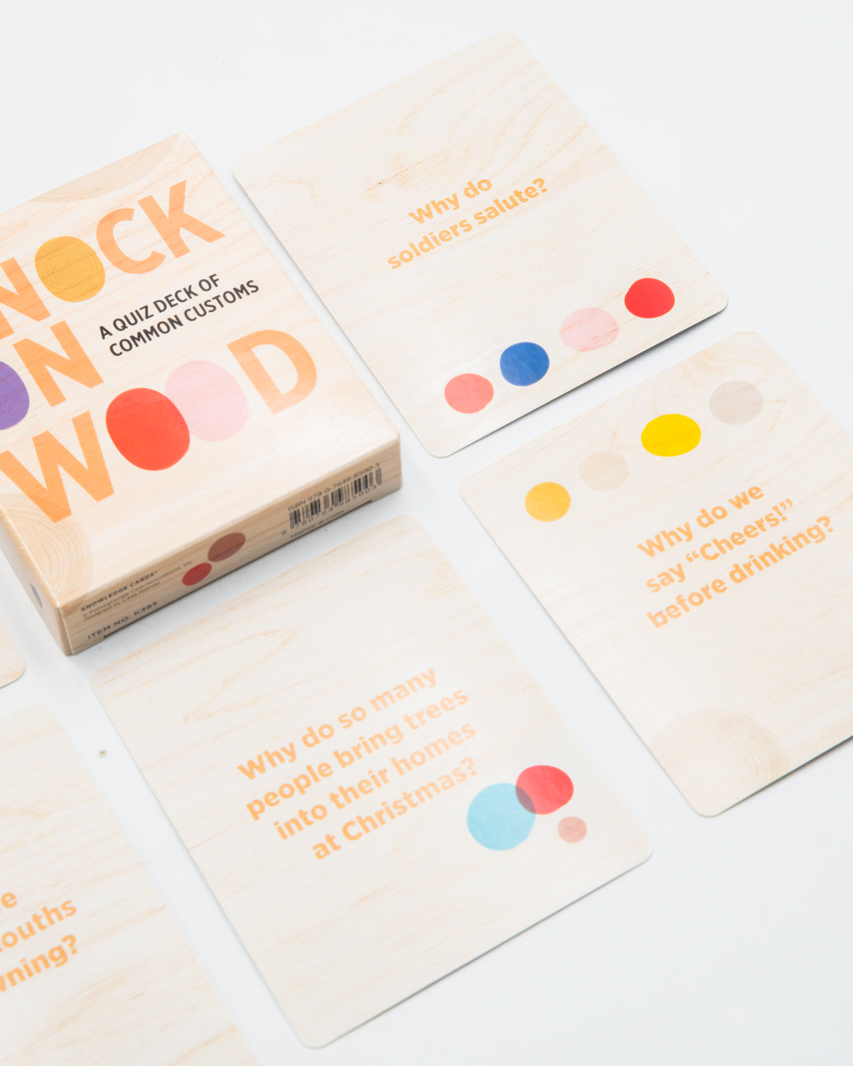 Knock on Wood cards asking where customs come from, laid out around the box