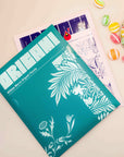 Pomegranate William Morris and Charley Harper origami kits in teal and lavender packaging