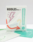 Riddles Vol. 2 card deck from Pomegranate's Card Decks for the Curious, in its box.