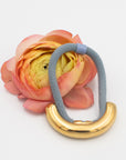 blue hair tie with gold cuff accessory