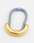 blue hair tie with gold cuff accessory