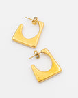 asymmetrical, '60s inspired gold earrings
