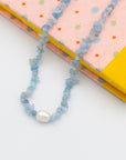 blue resin puka necklace with pearl