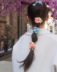 girl wearing pink and blue baby satin scrunchies in a bubble b raid