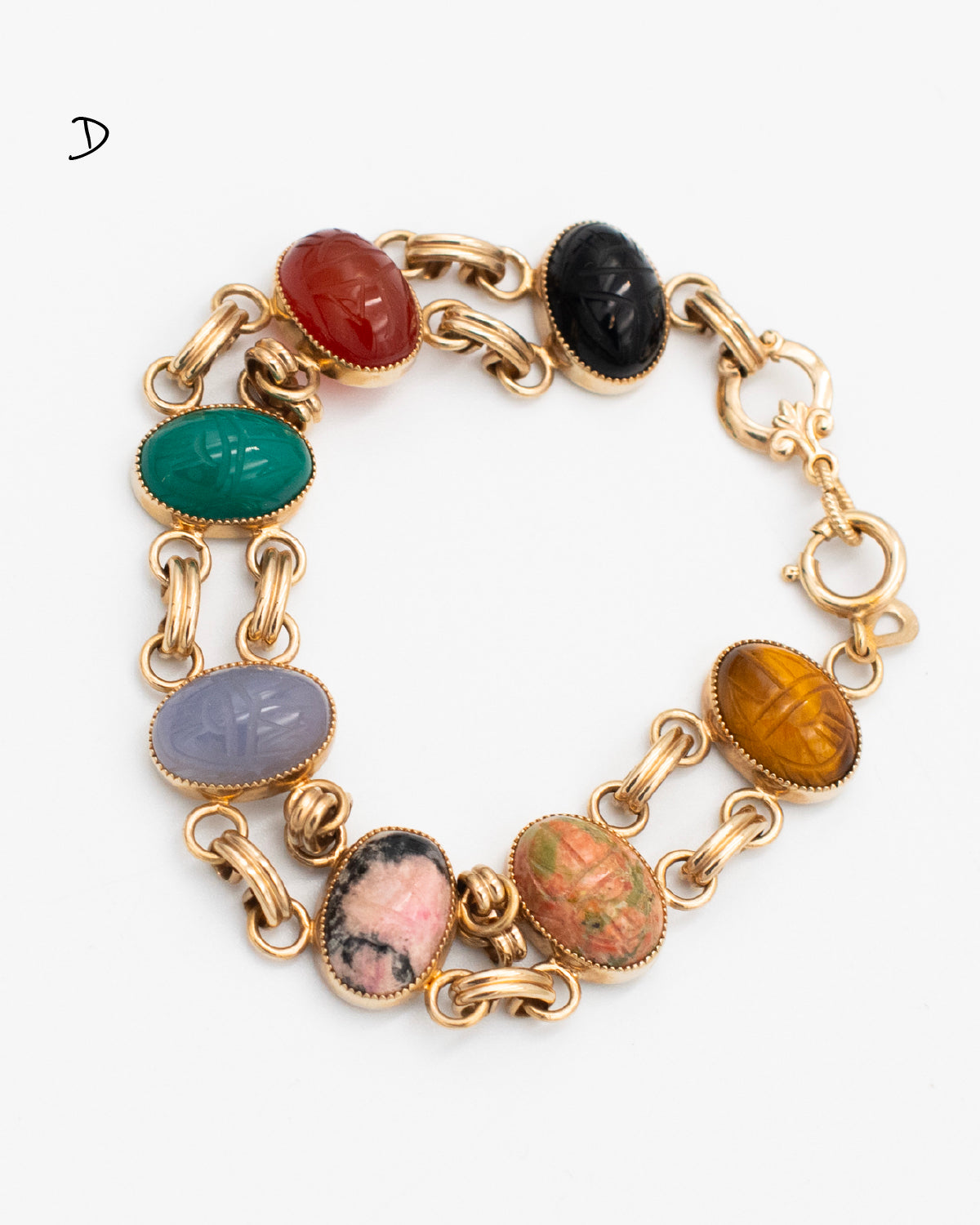 Vintage scarab bracelet with seven carved gemstone including: tiger's eye, blue chalcedony, green chalcedony, moss agate, carnelian, rhodonite, rhyolite connected via gold-filled double link setting