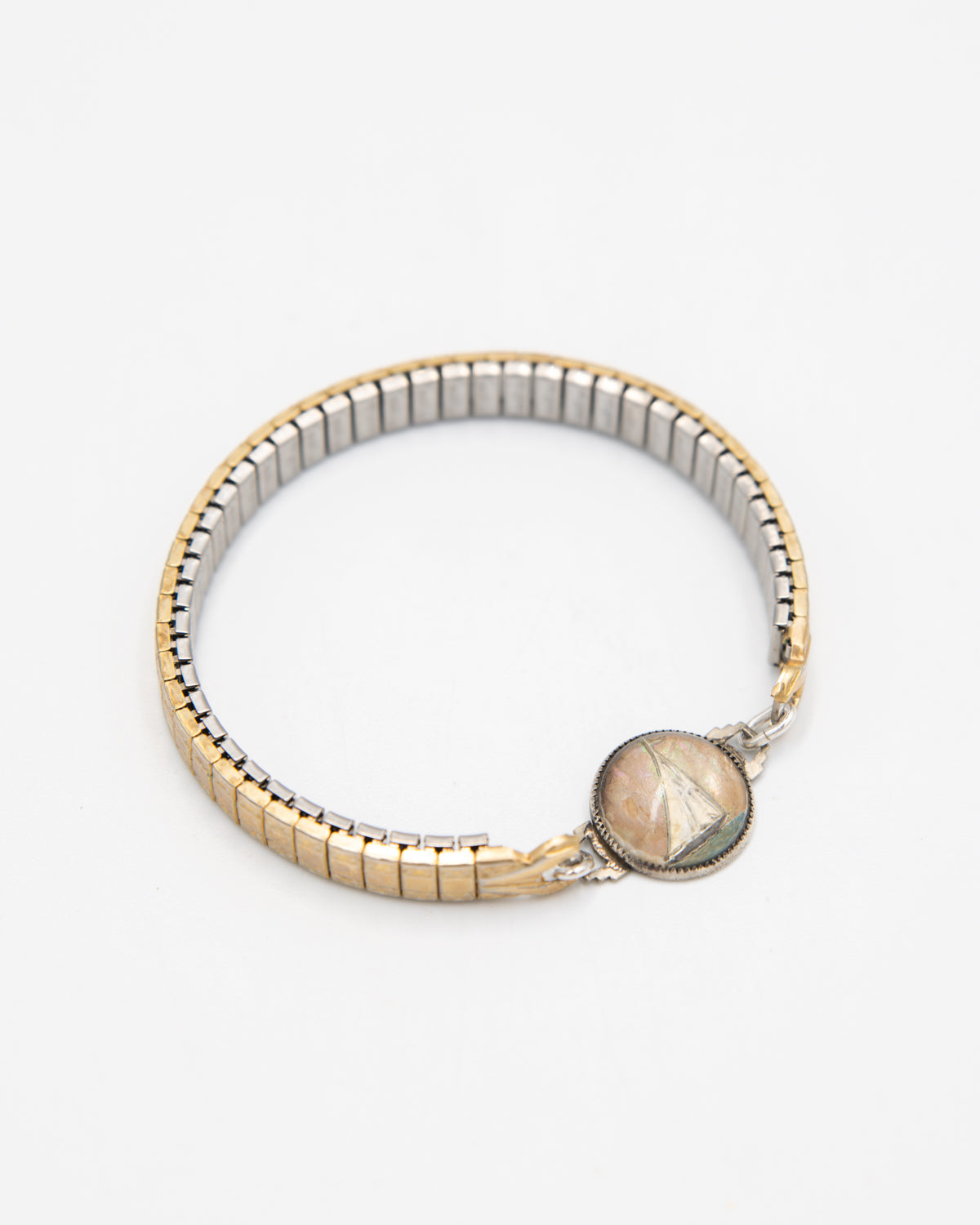 Vintage bracelet with gold expansion brand and hand-painted sailboat design on a white background