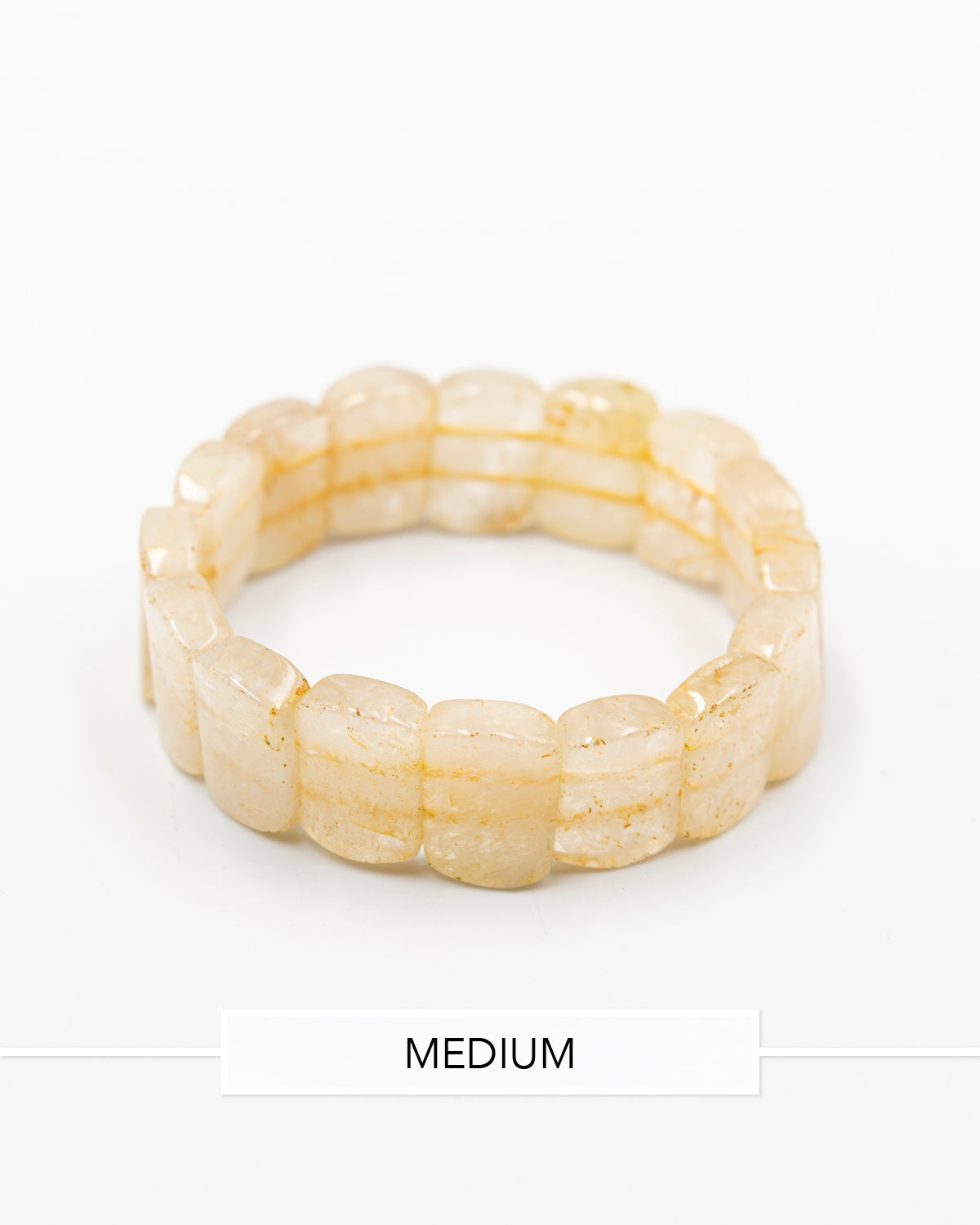 Single rutile quartz beaded stone bracelet with translucent honey-toned beads photographed flat against a white background.