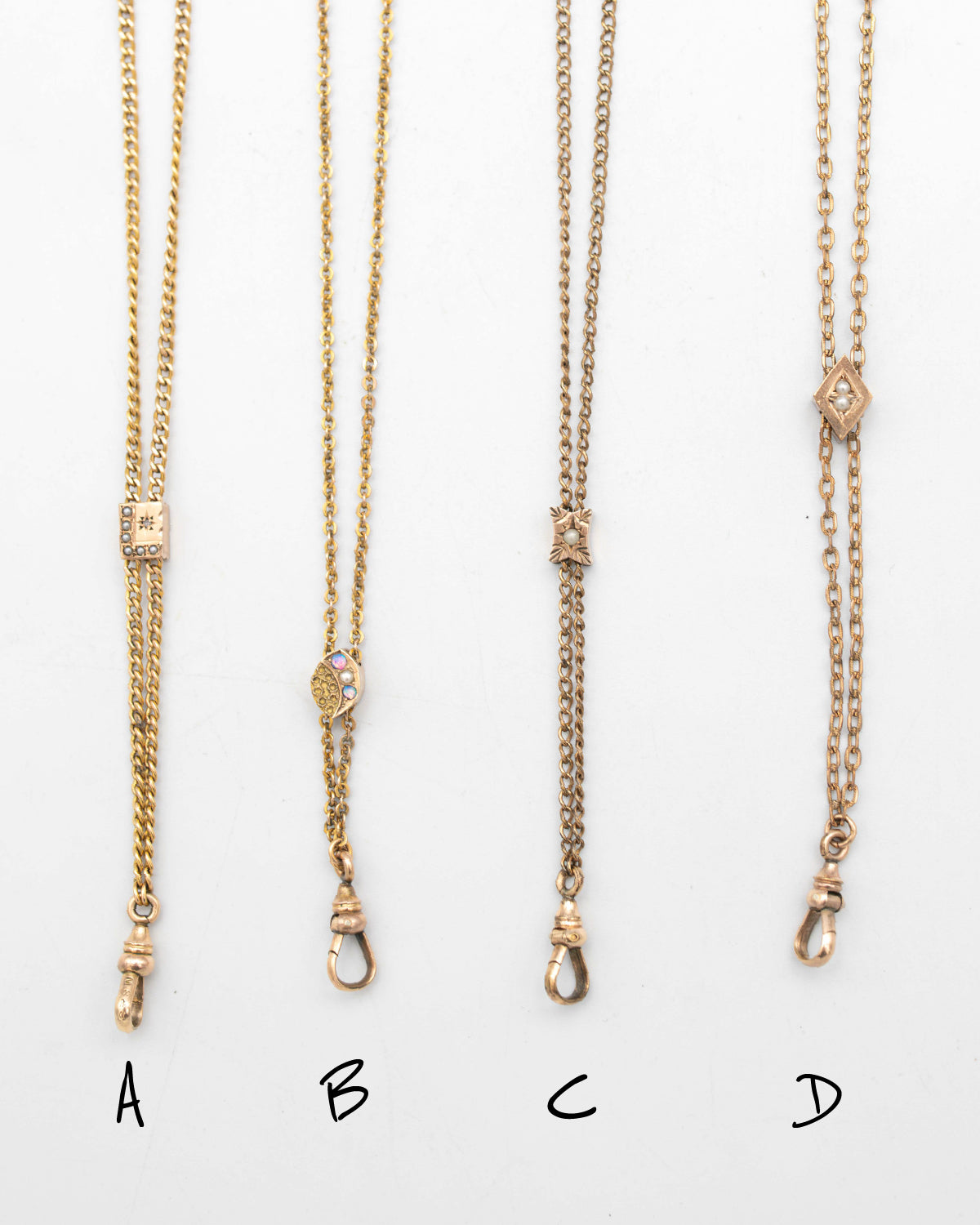 Four gold-toned chain slider necklace options labeled A, B, C, and D, shown flat against a white background with handwritten labels below each necklace.