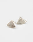 Pair of silver fan-shaped earrings on a light gray background