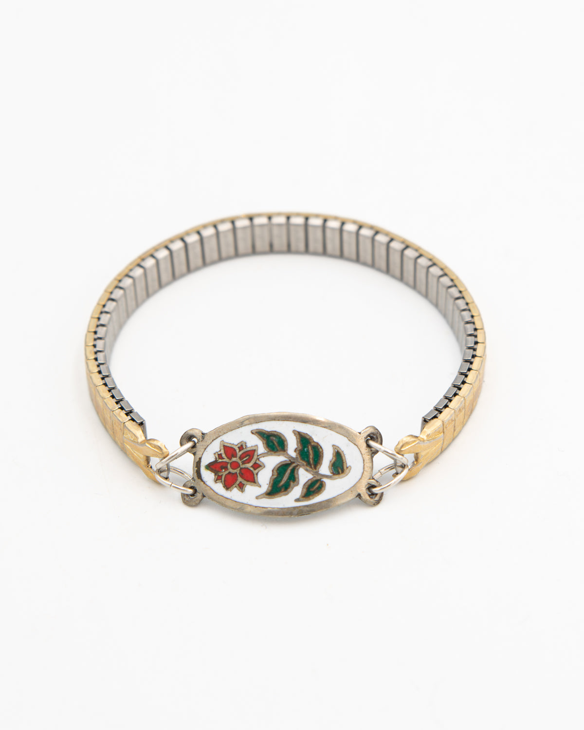 Winter Bloom bracelet with an enameled red and green flower link on a gold-fill watch band