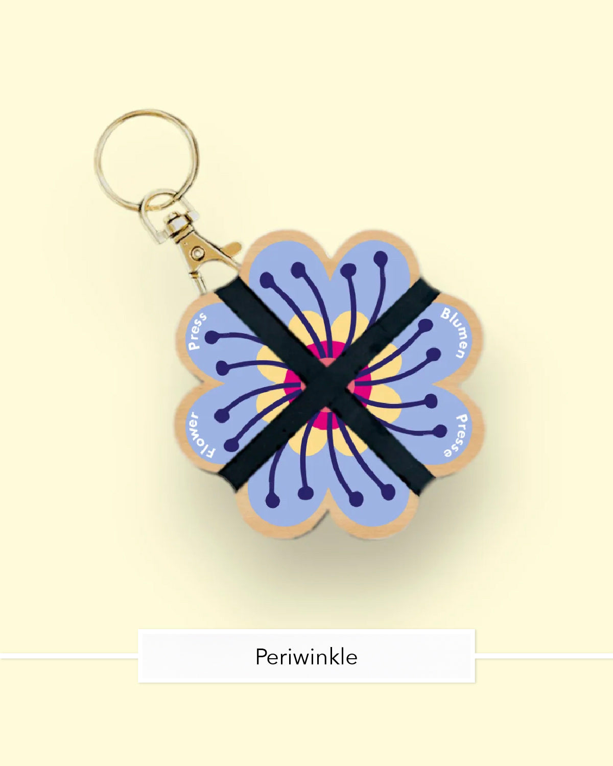 Studio Wald flower press keychain in the Periwinkle design with a gold clasp