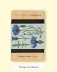 Studio Wald wooden flower press in the Vintage Cornflowers design with black straps