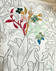 Floral coloring page partly filled in with red, green and blue Tombow brush pen ink.