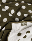Closeup of small business, Typical's terry cloth stretchy towel in reversible polka dot print. 