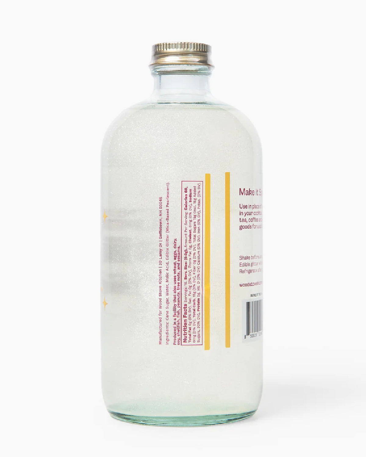 Back of the Glitter Simple Syrup bottle with its label and shimmering syrup inside